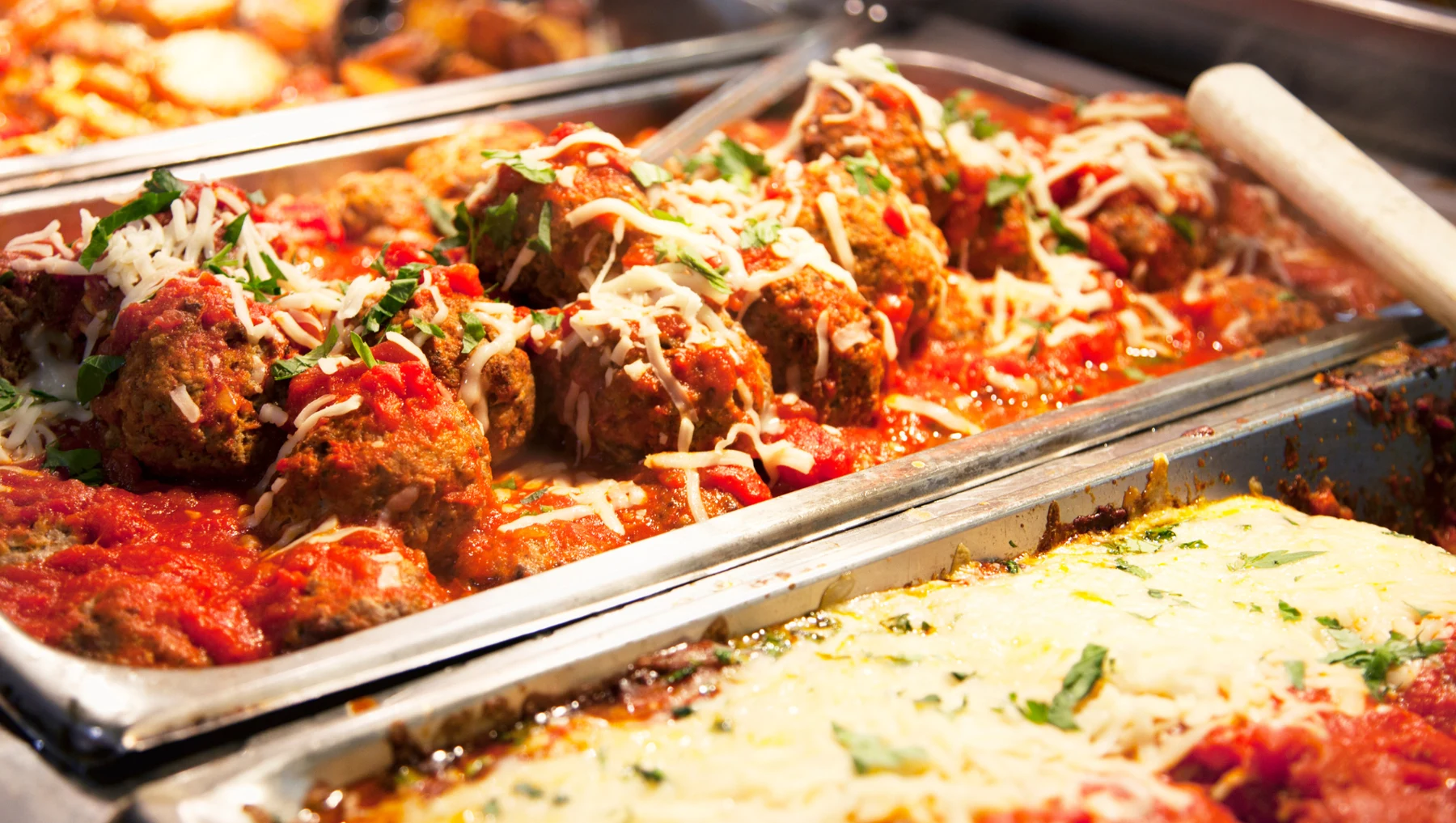 Trays of Italian food ready for a catered gathering